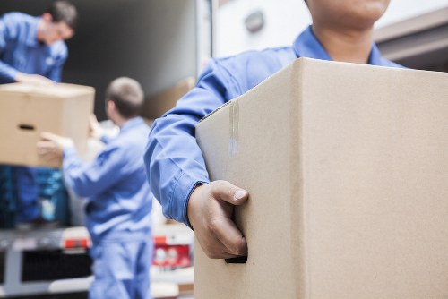 Student removals team loading boxes and furniture in Coulsdon