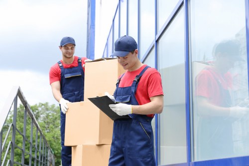 Professional flat removals planning in Coulsdon with boxes and moving equipment