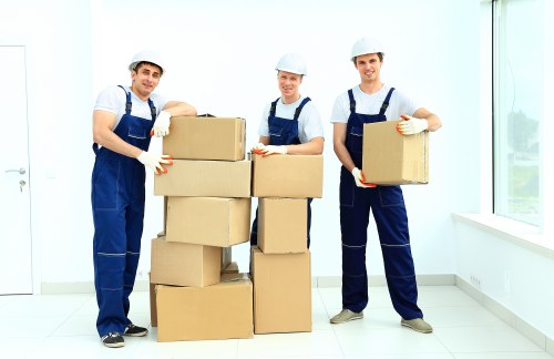 Removal team handling bulky furniture safely during a Coulsdon move