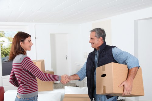 Local removal team handling furniture during a Coulsdon house relocation
